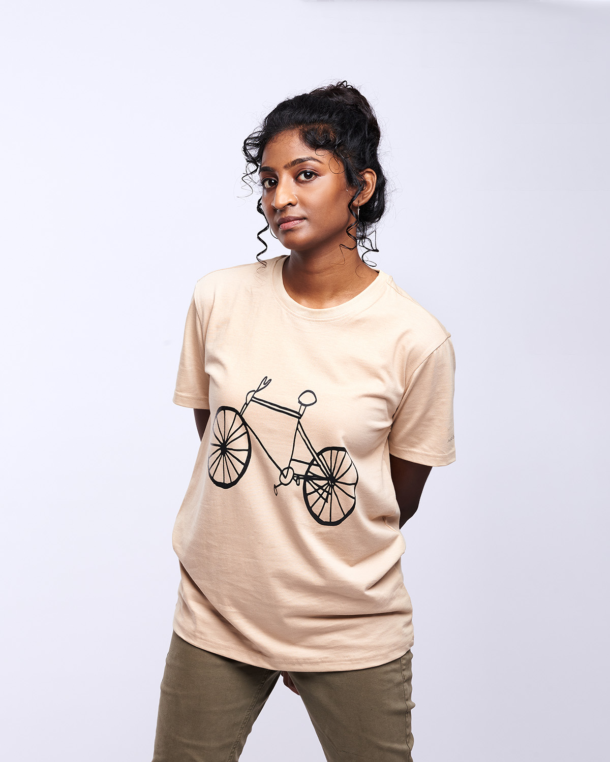 airgarb beige cream round neck cotton printed cycle wearing model medium size