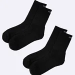 Pack of three black crew length cotton socks, designed for both men and women, featuring cushioning for all-day comfort, by Air Garb.