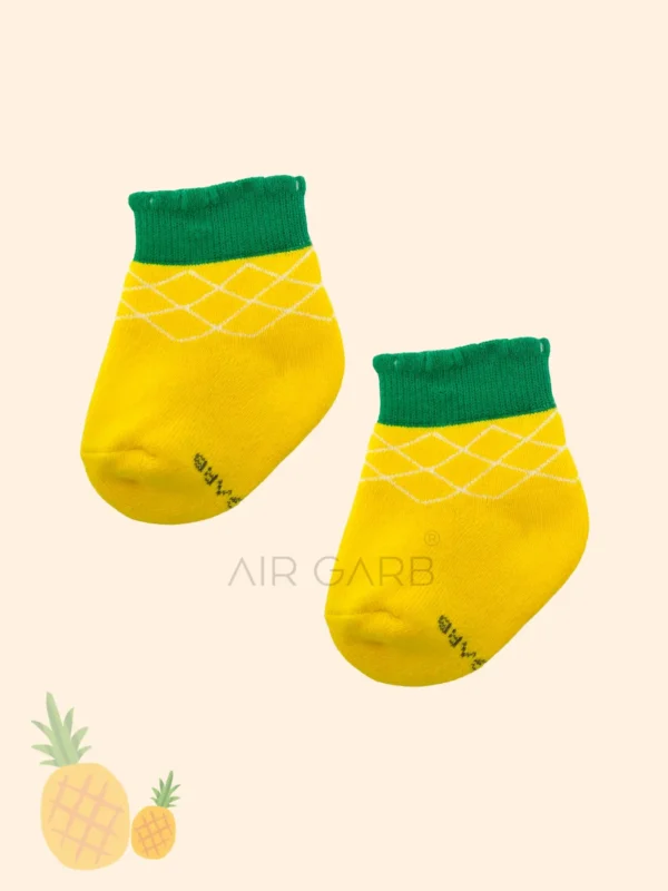 The set includes 3 pairs featuring playful designs of watermelon slices, cherries, and pineapples, making them an ideal gift for active toddlers.